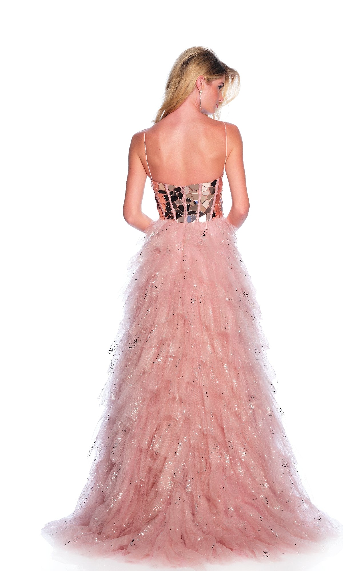 A woman with long blonde hair is seen from the back wearing the sleeveless Dave & Johnny 12037 rose pink prom dress, featuring a tiered tulle skirt and silver sparkles, against a white background.